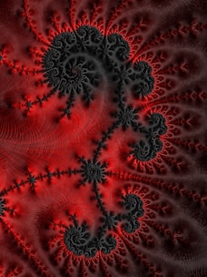 a computer generated image of red and black swirls