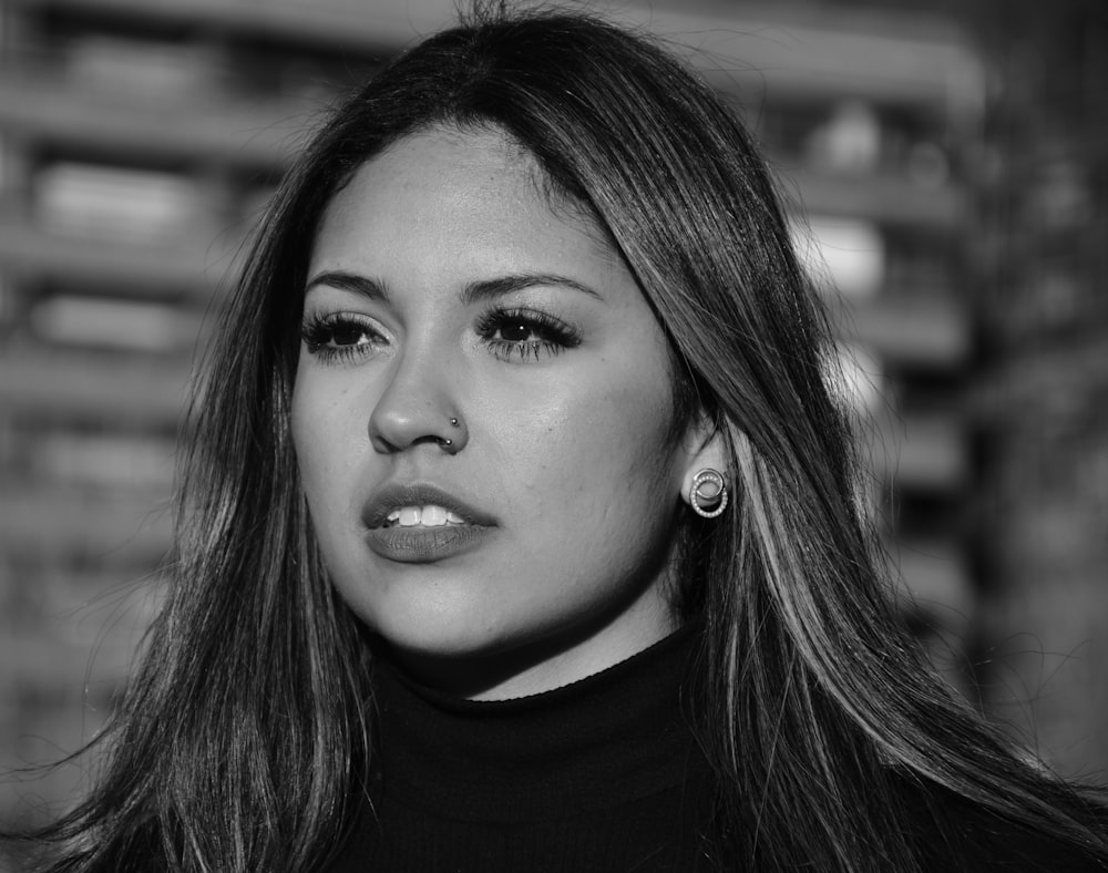 a black and white photo of a woman with long hair