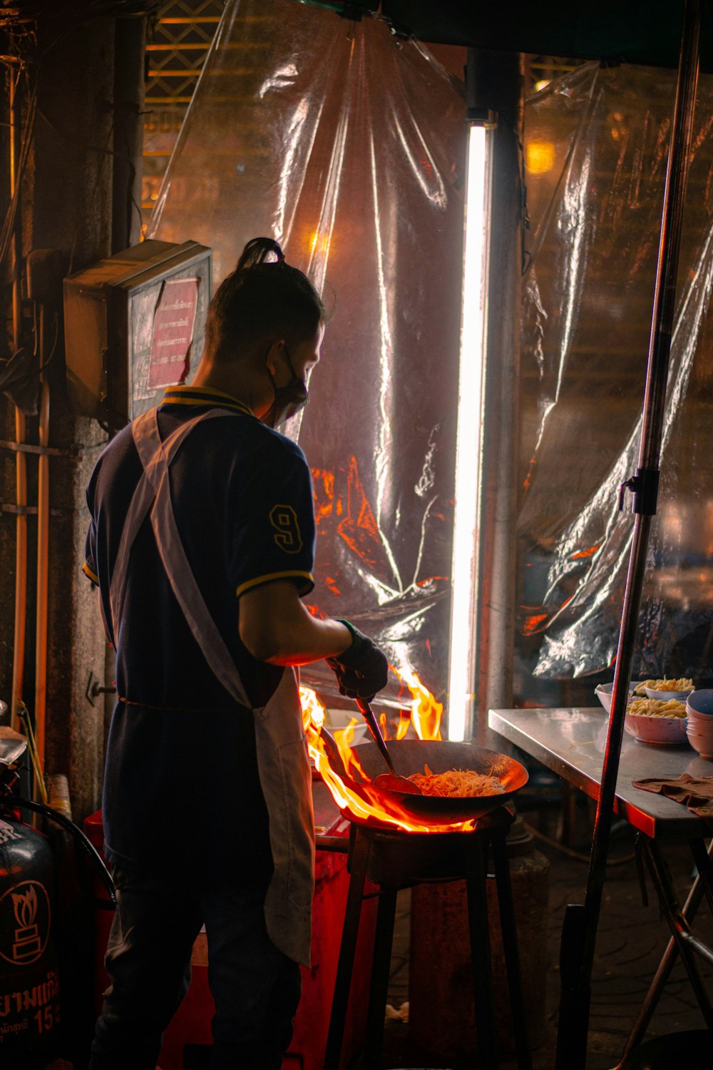 a man is cooking food on a grill