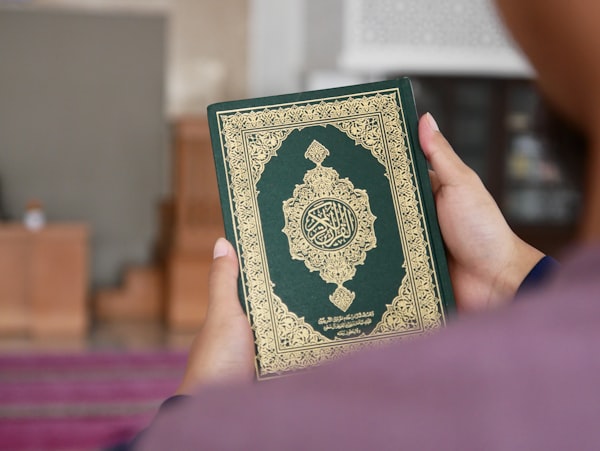 Person holding Quran