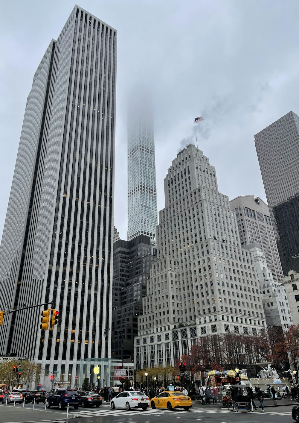 a city street filled with lots of tall buildings