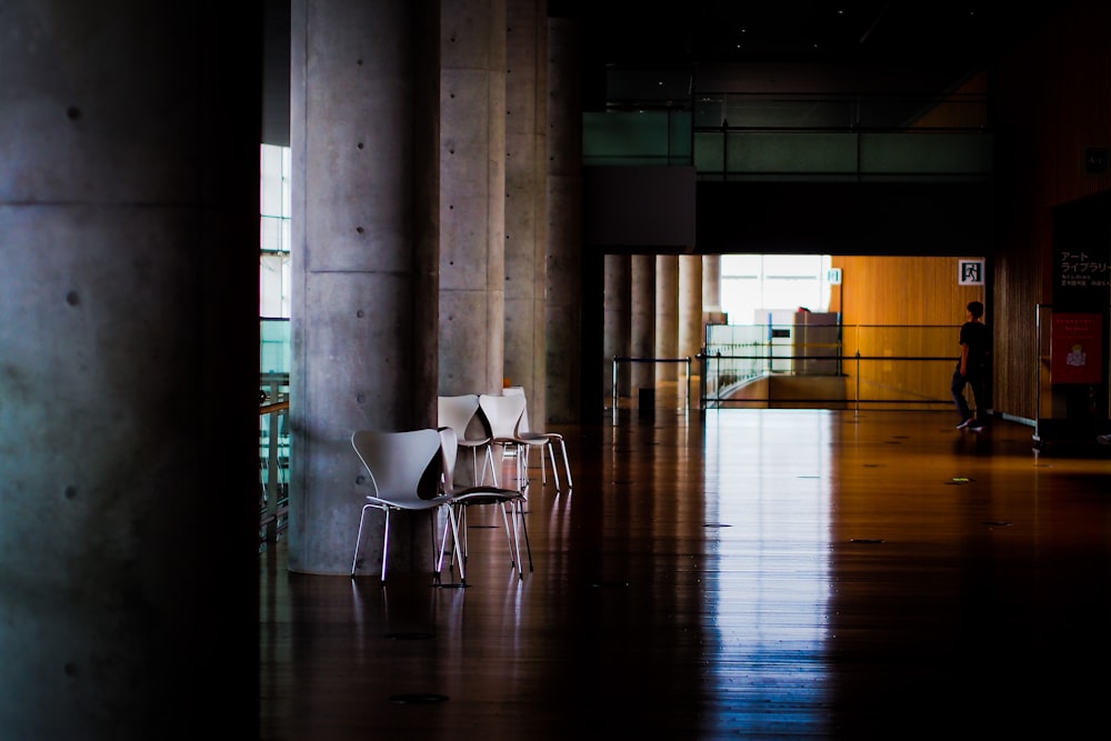 a couple of chairs that are sitting in a room