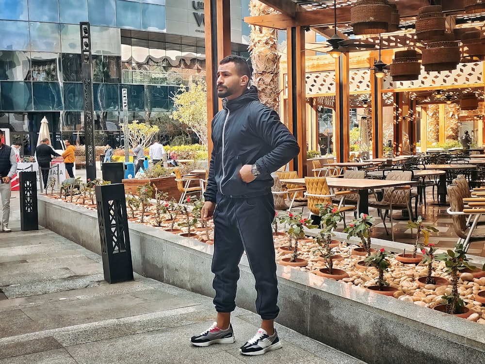 a man standing in front of a building