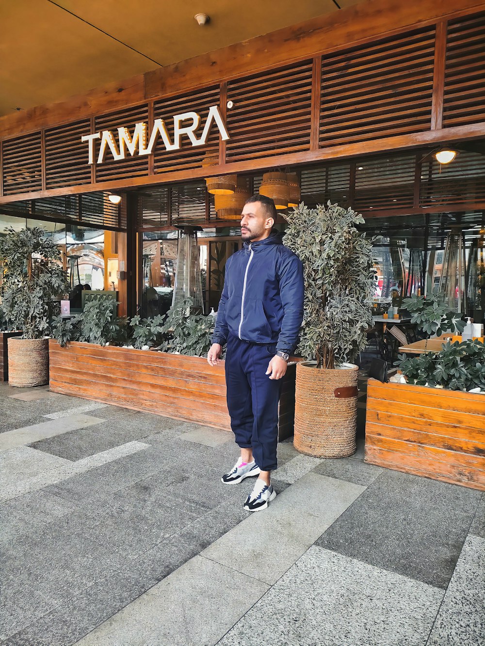 a man standing in front of a store