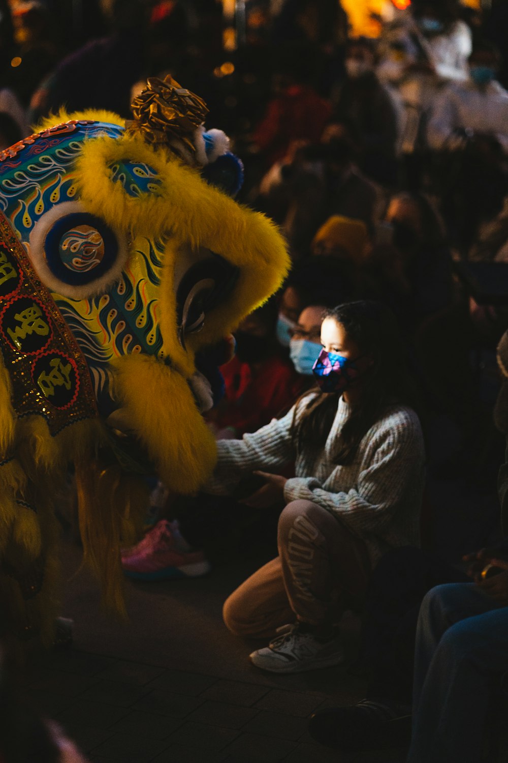a person in a lion costume with a mask on