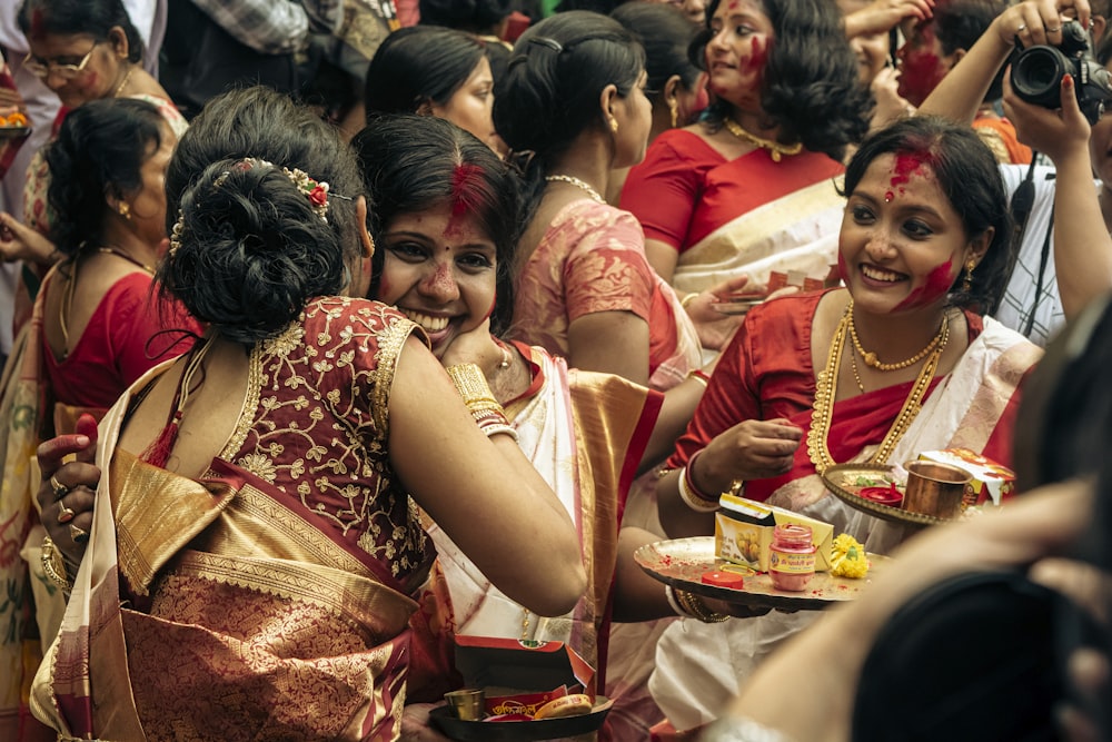 a group of women standing next to each other