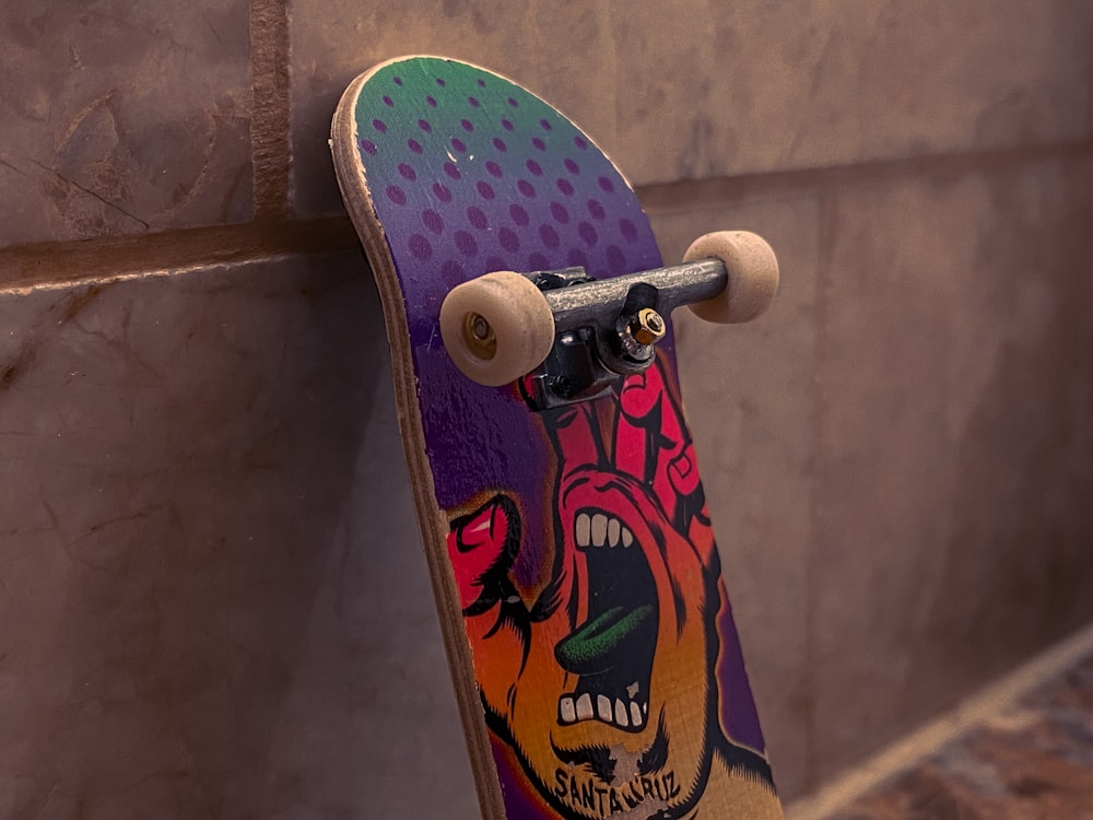 a skateboard is leaning against a wall