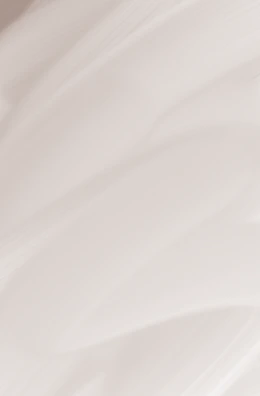 Minimalist close-up of golden geometric lines on a soft beige background.