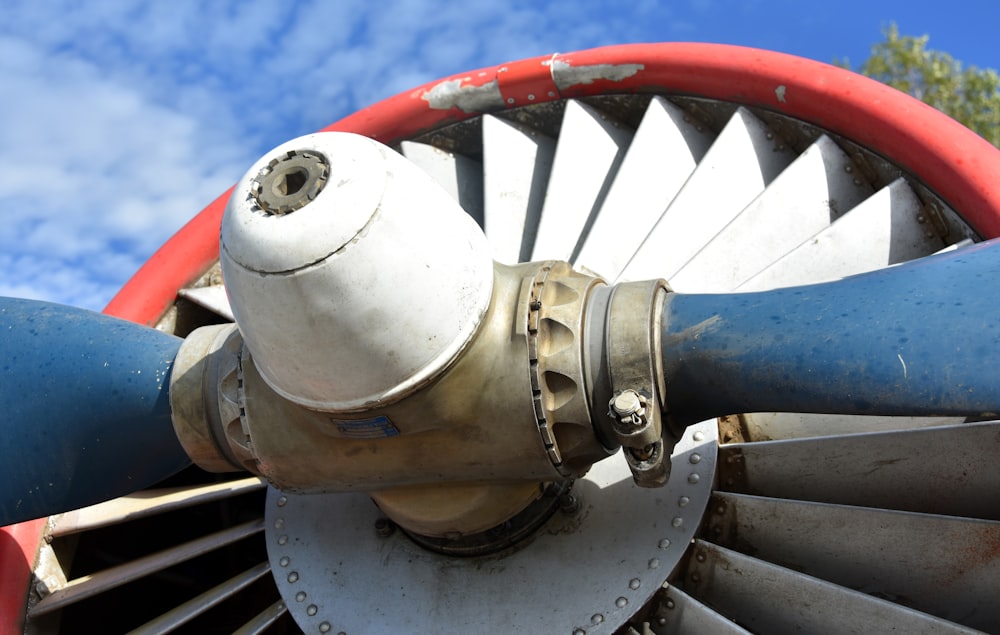 a close up of a large metal object with a sky background