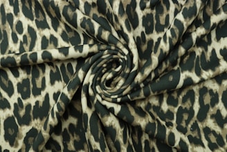a green and white animal print fabric