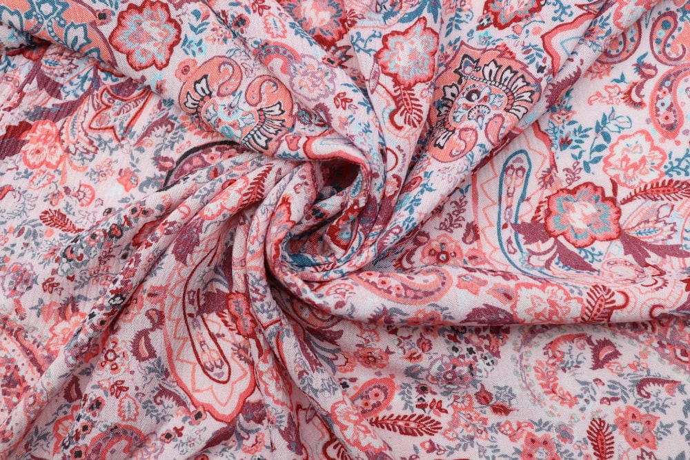 a red and blue paisley print fabric