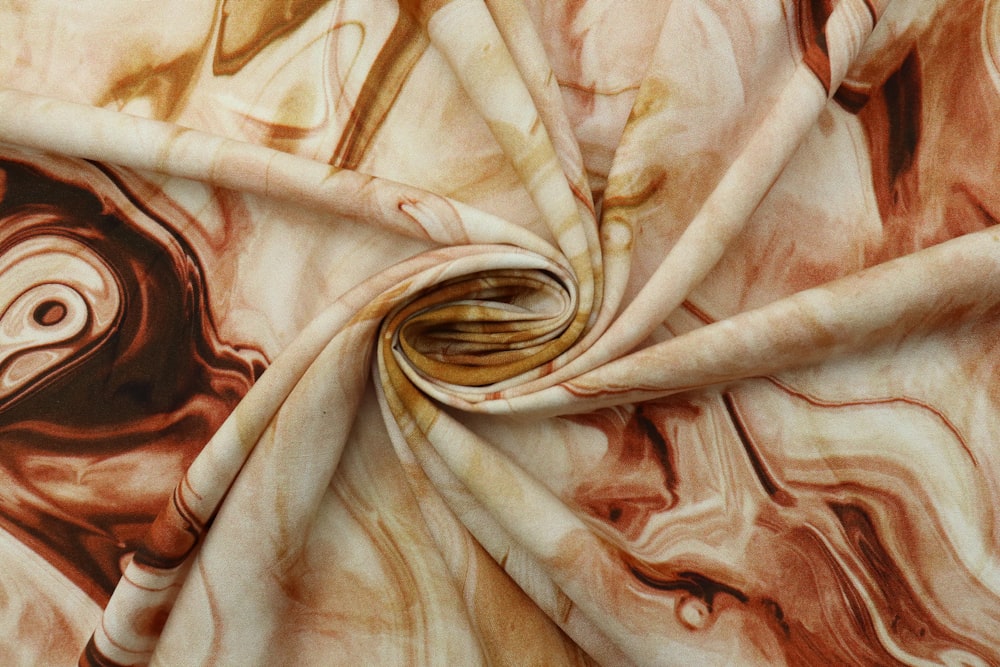 a close up of a fabric with a swirl design