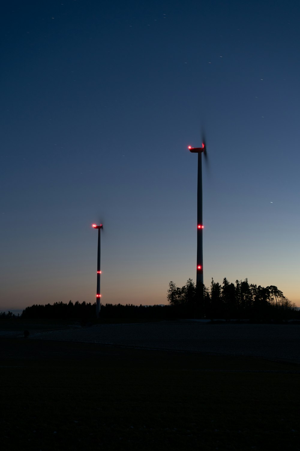 a couple of red lights that are on a pole