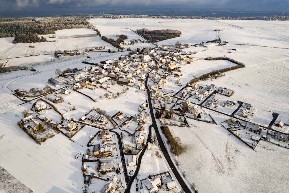 an aerial view of a snow covered town