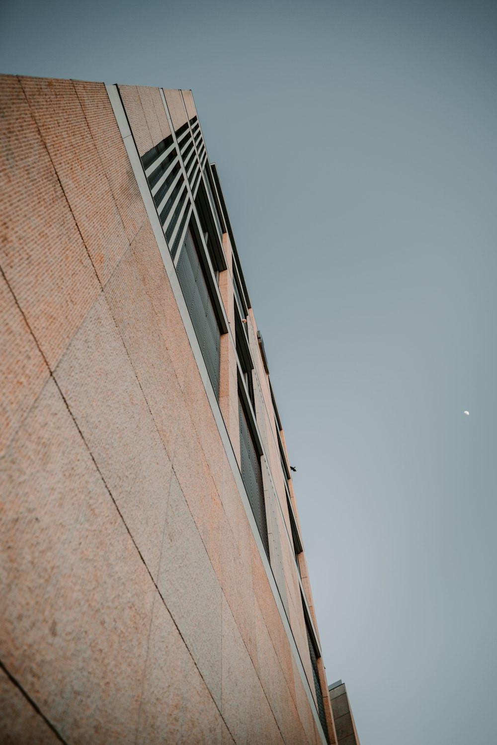 a tall building with a clock on the side of it