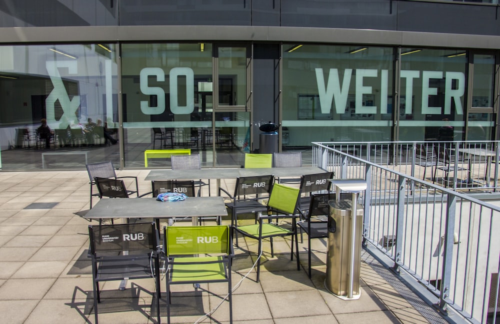 a table and chairs outside of a building