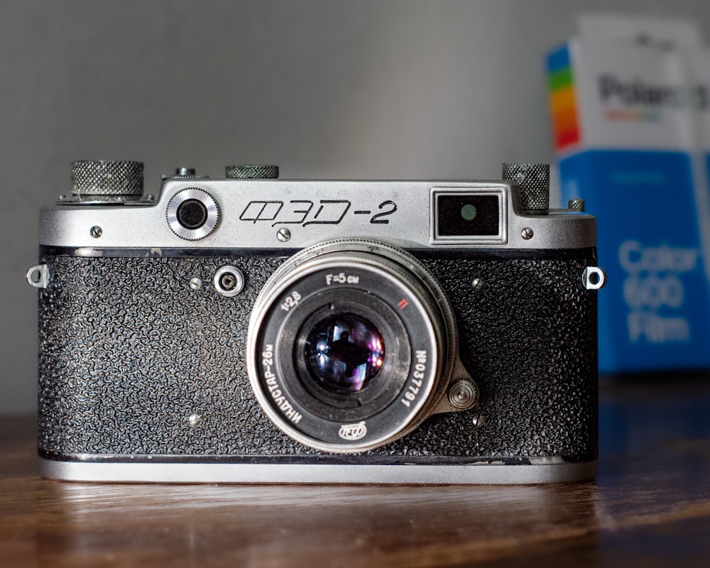 a camera sitting on top of a wooden table