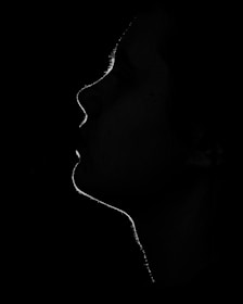a black and white photo of a woman's face