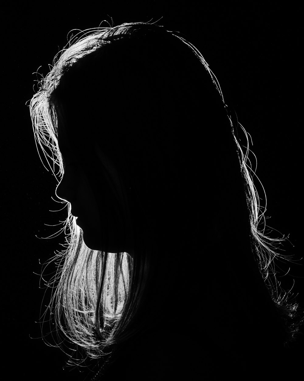 a black and white photo of a woman's face