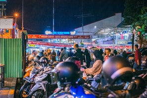 A bustling street market in Hanoi filled with colorful stalls and lively locals.