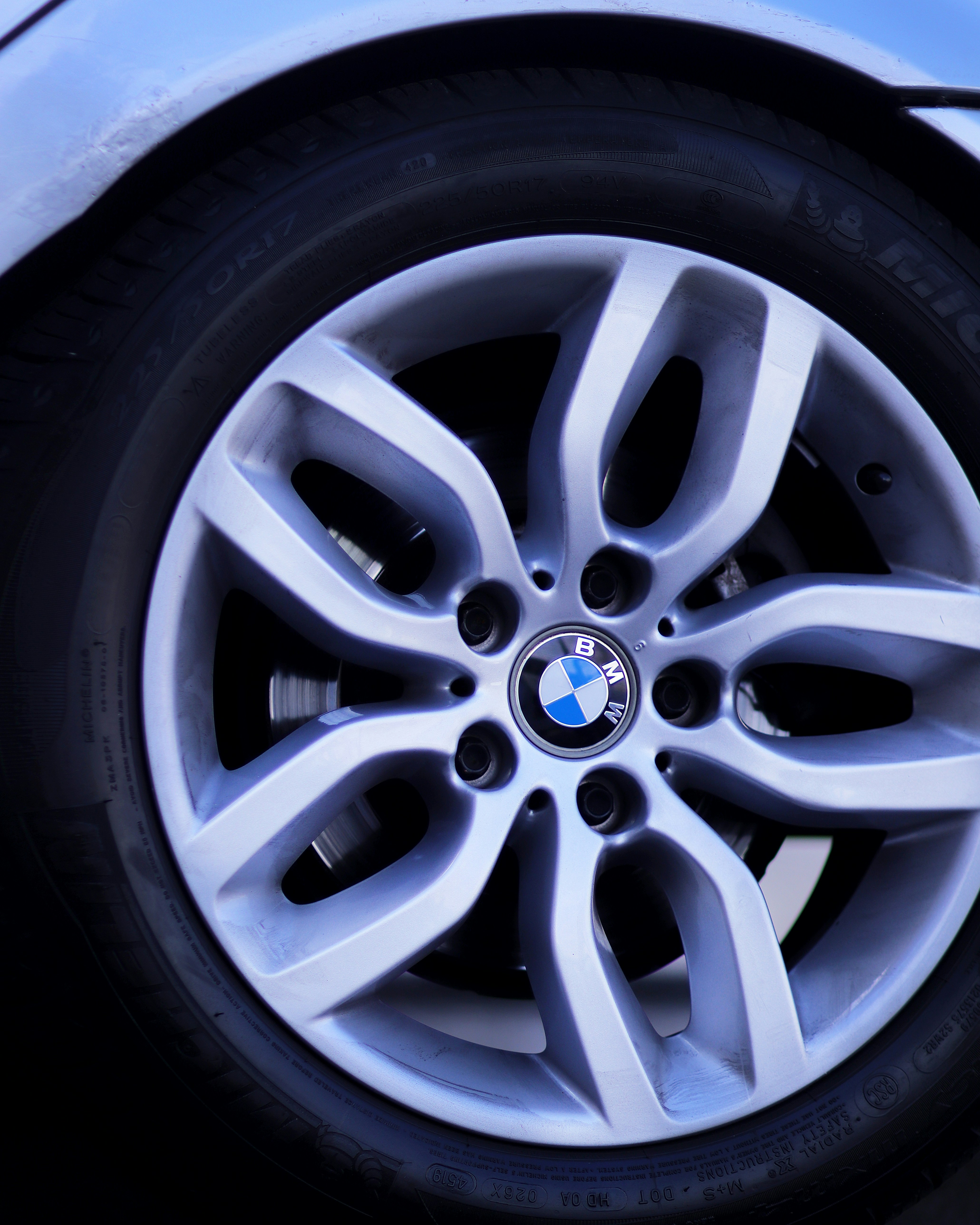 A close up of a wheel on a car photo – Free Blue Image on Unsplash