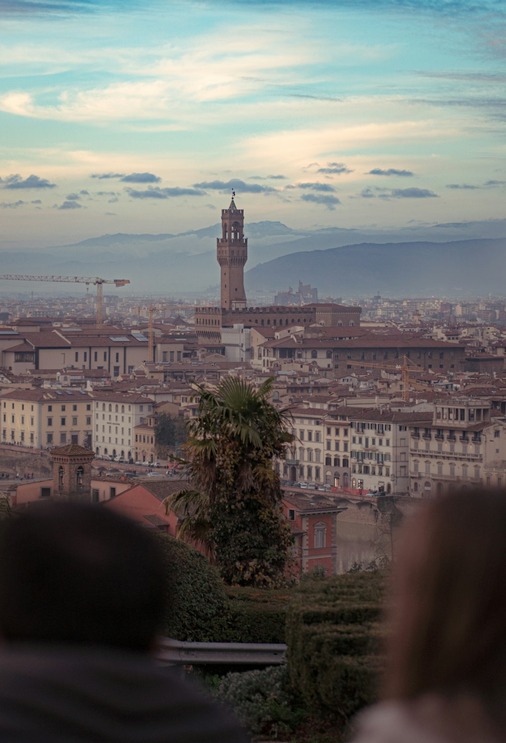 a view of a city with a clock tower in the distance