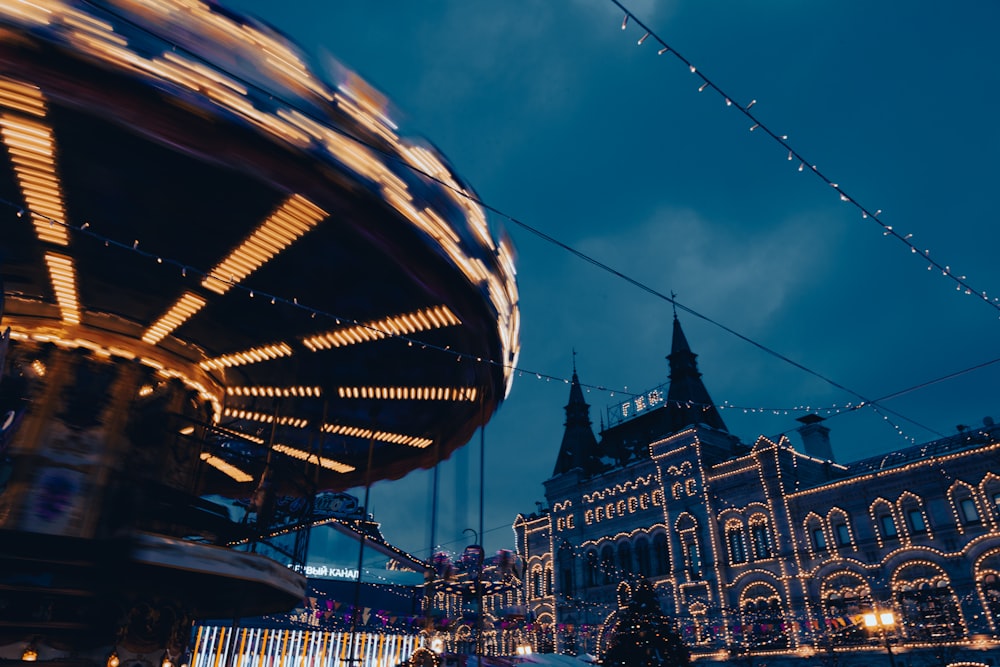 a merry go round at night in a city