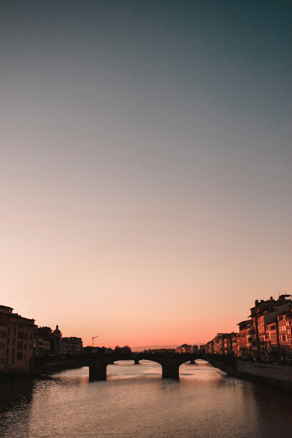 a view of a bridge over a body of water