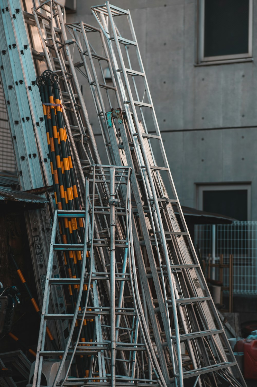 a large metal structure sitting next to a building