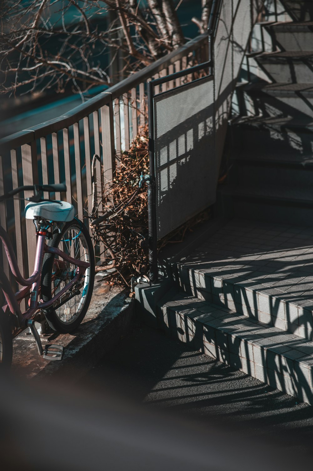 a bicycle parked on the steps of a building