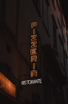a neon sign on the side of a building