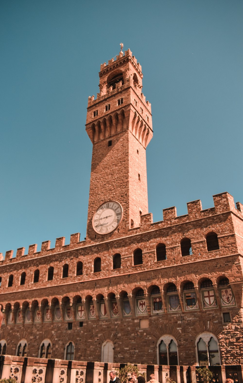 a large brick building with a clock tower