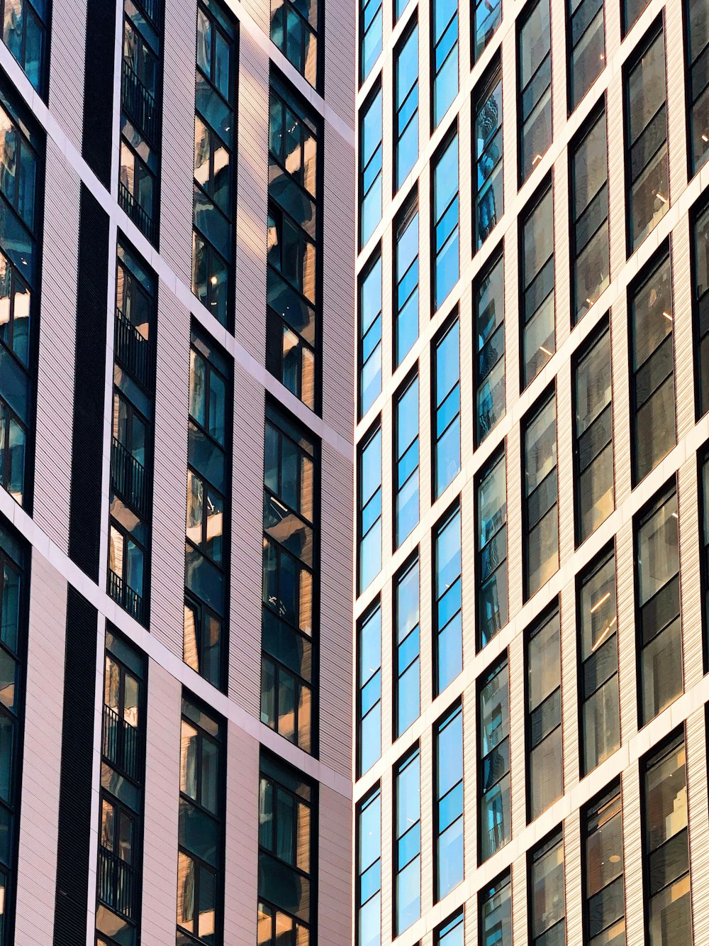 a couple of tall buildings next to each other