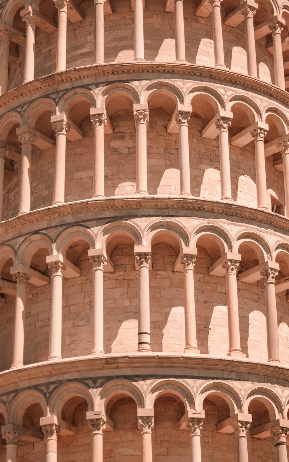 a close up of a very tall building with arches