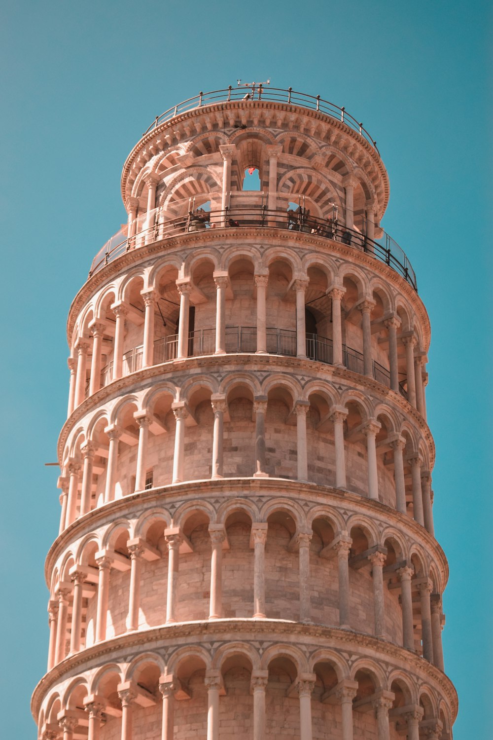 a very tall tower with a clock on it's side