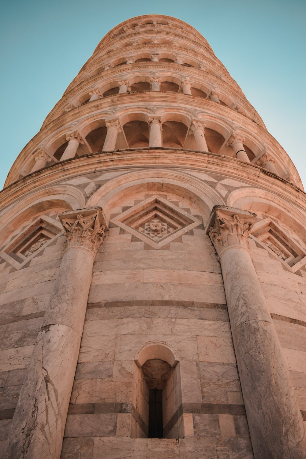 a tall tower with a clock on the top of it