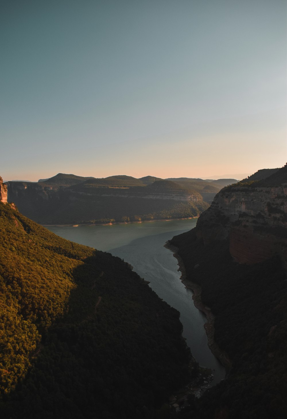 a scenic view of a body of water and mountains