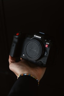a person holding a camera in their hand