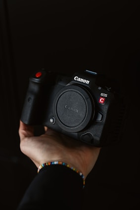 a person holding a camera in their hand