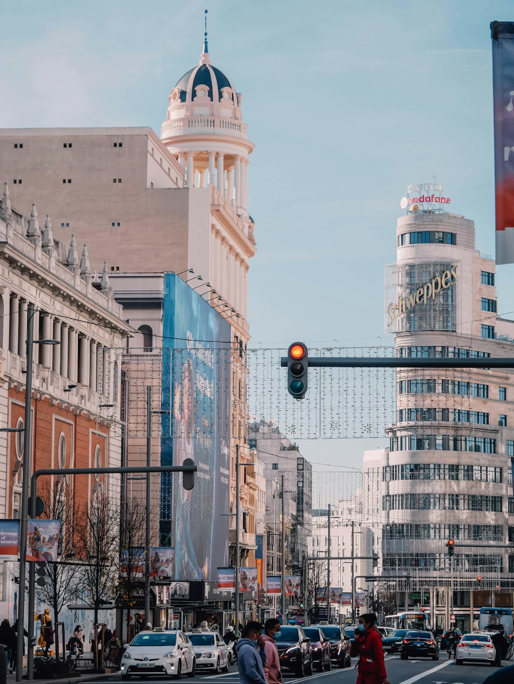 a traffic light hanging over a city street