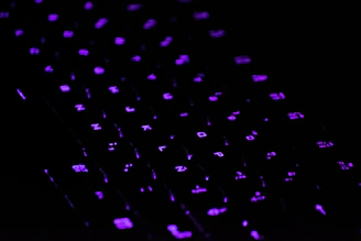 a close up of a keyboard in the dark