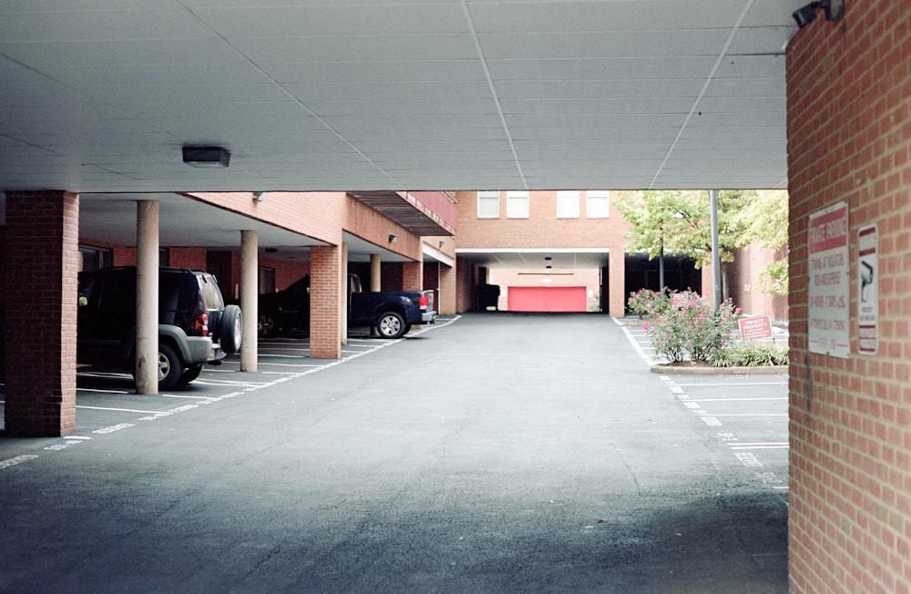 an empty parking lot with cars parked in it