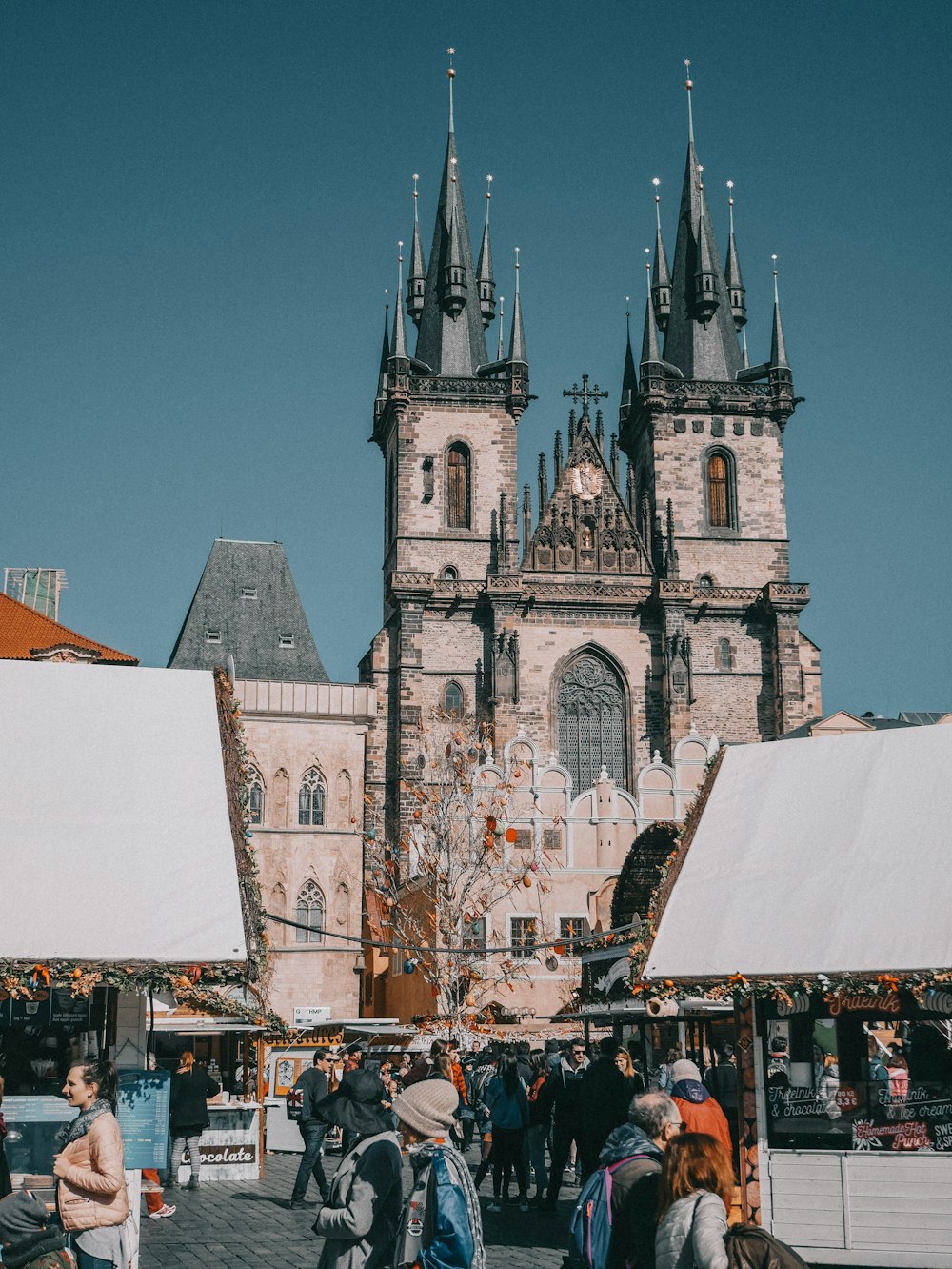 a group of people walking around a market