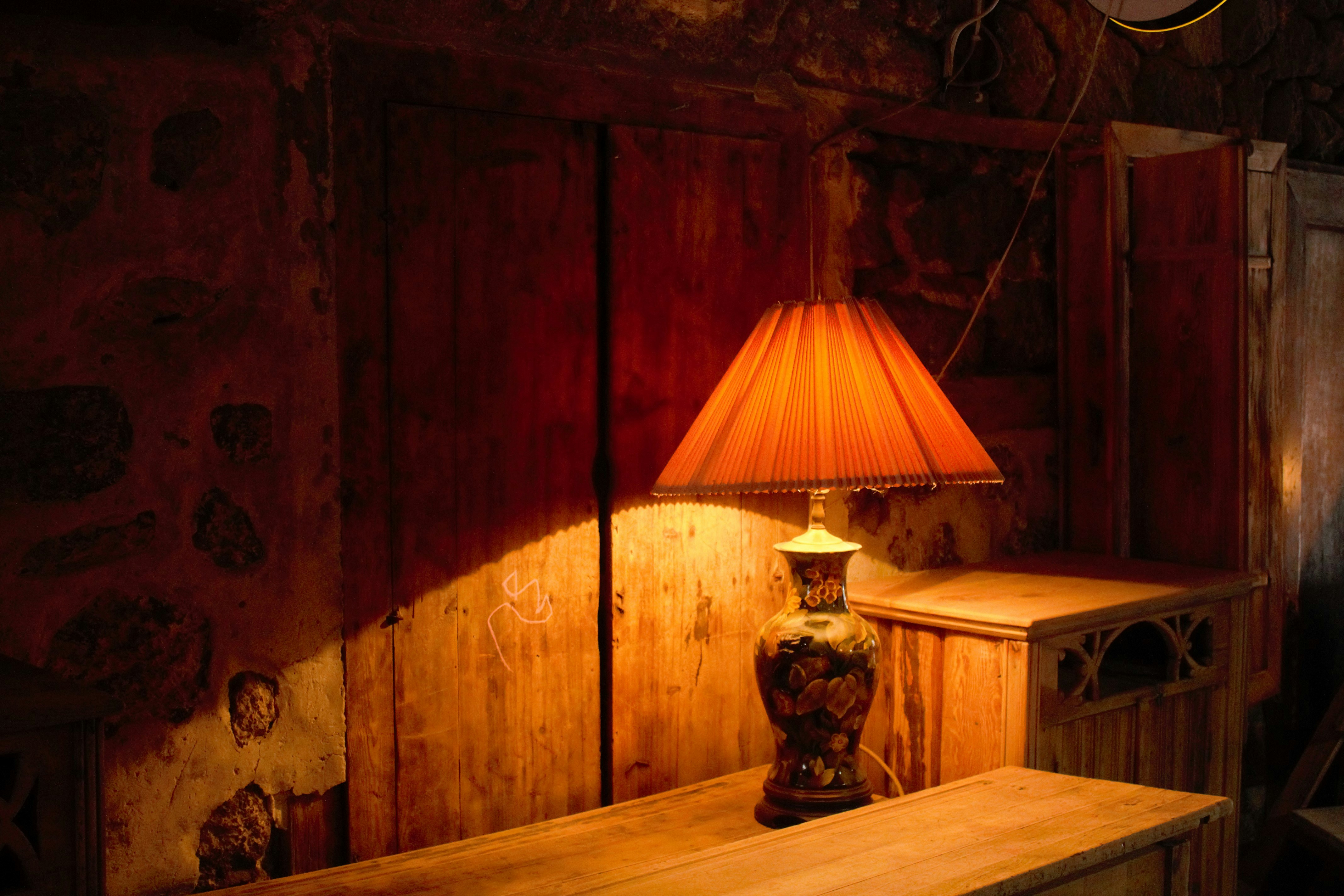 a lamp sitting on top of a wooden table