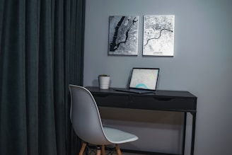 A sleek, minimalist office space with a large map of Europe on the wall, highlighting various project locations.