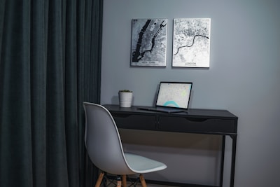A sleek modern workspace with a globe and travel books, evoking the spirit of urban travel.