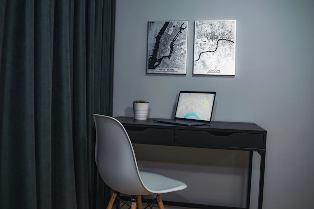 Elegant office workspace with antique maps and a compass highlighting international connections.