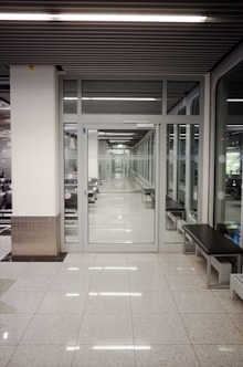 a long hallway with a bench in the middle of it