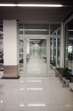 a long hallway with a bench in the middle of it
