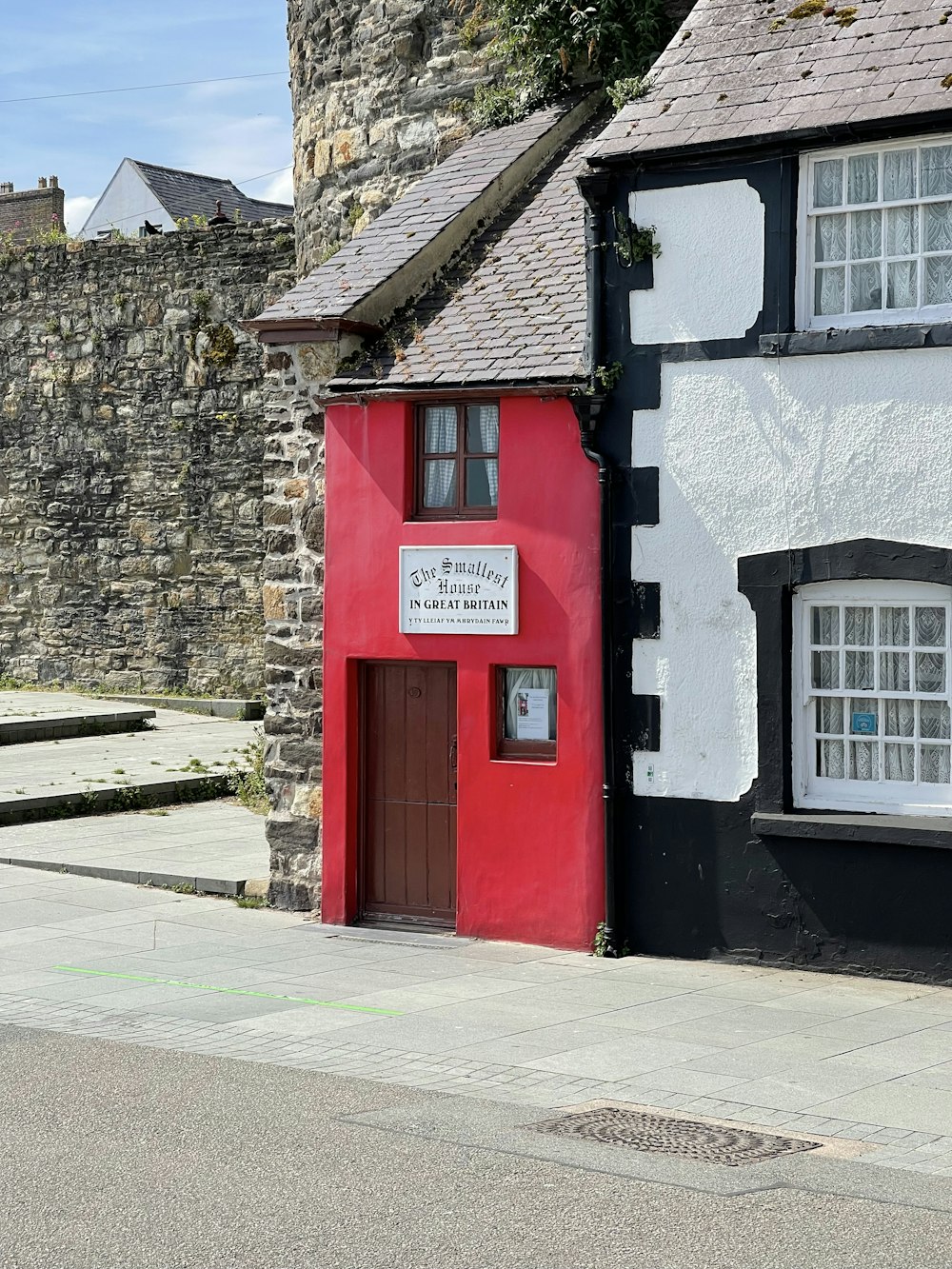 a red and black building with a sign on it